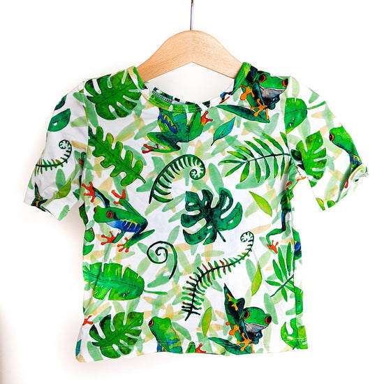 T-shirt with frog print hanging on hanger