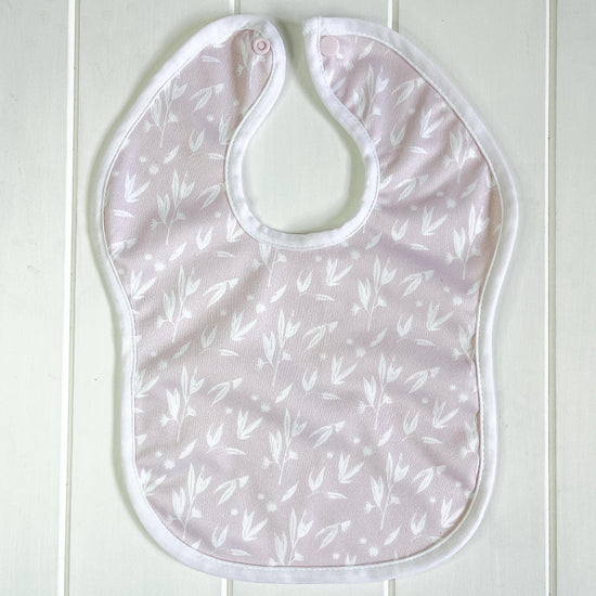 Baby bib with pink floral print
