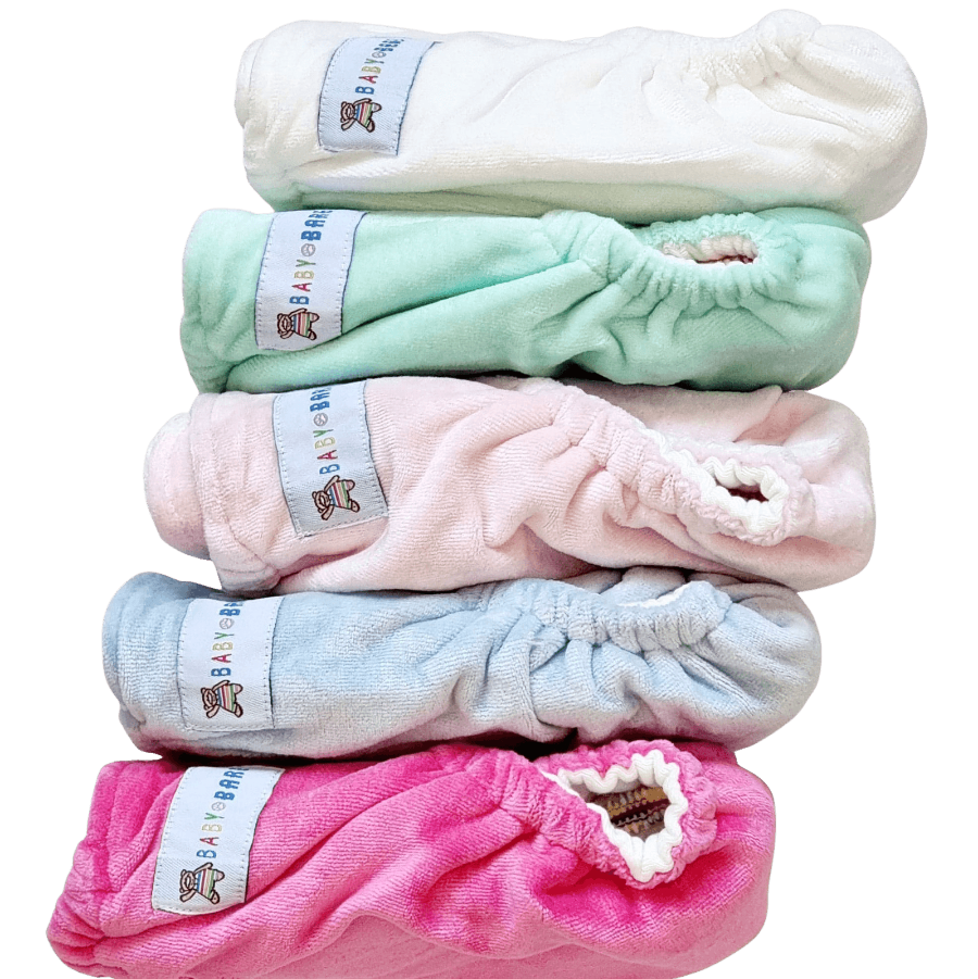 
                  
                    Stack of velour cloth nappies in different pastel colours
                  
                