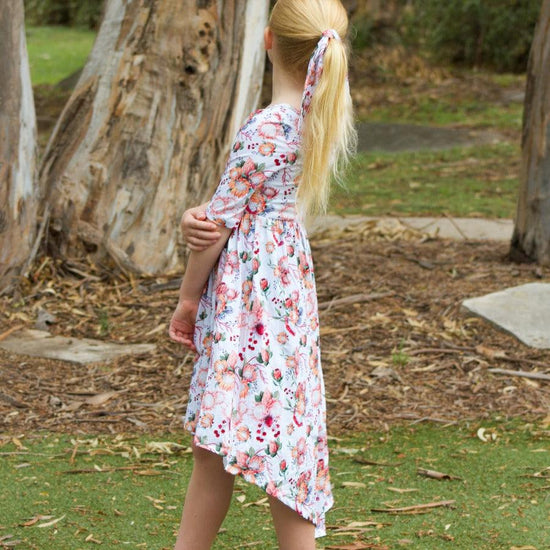 Young girl wearing a dress in a park