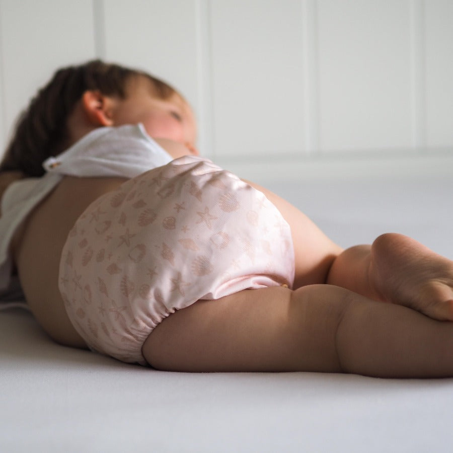 
                  
                    Baby wearing seashell nappy
                  
                