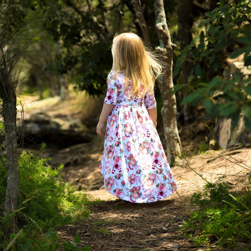 Little girl wearing floral dress.