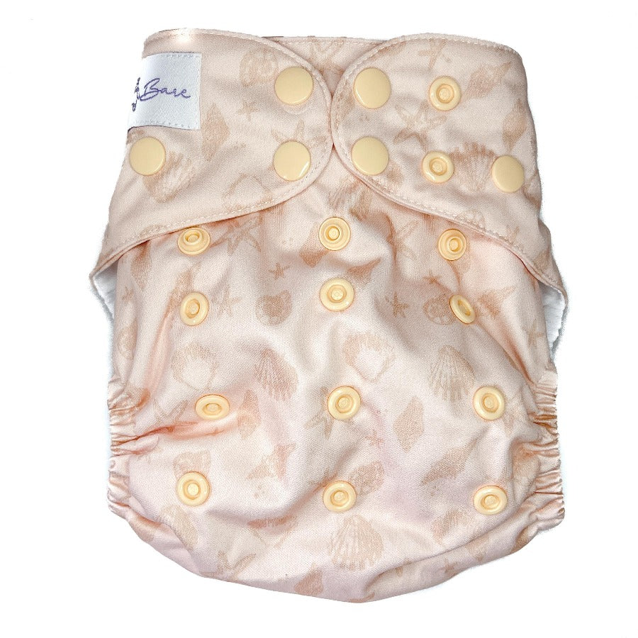 Cloth nappy with seashell printed fabric. 
