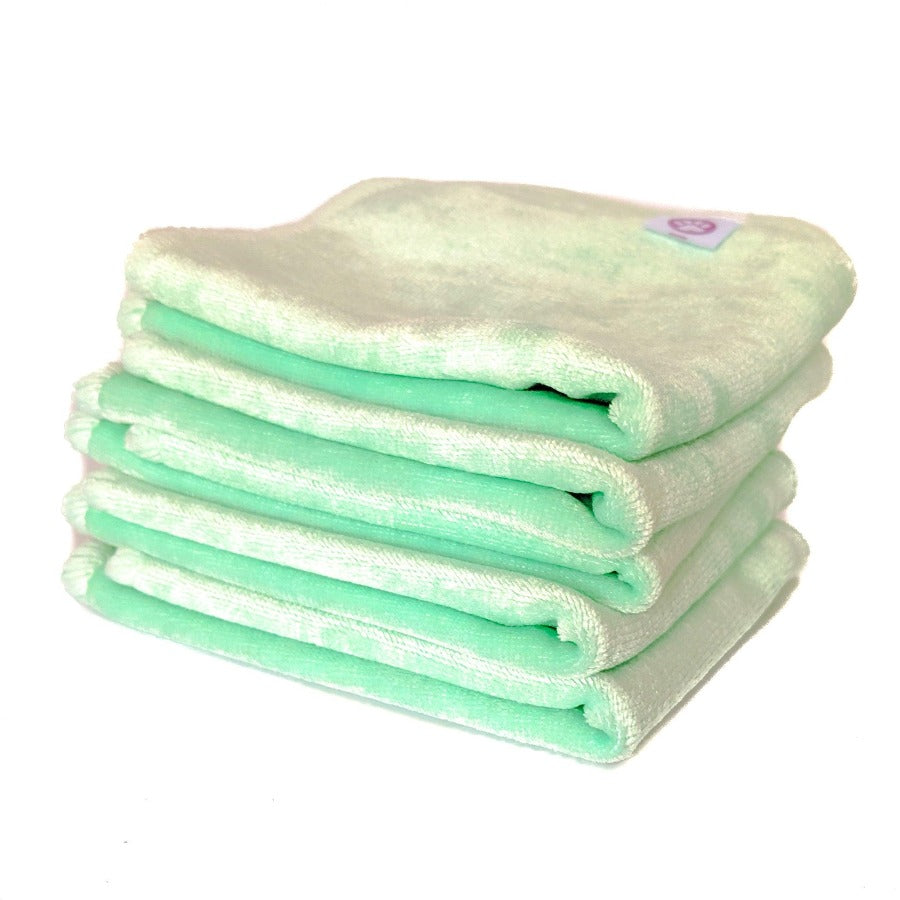 
                  
                    Pile of mint green cloth wipes
                  
                