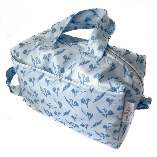 Pod bag with blue gumnut print. 