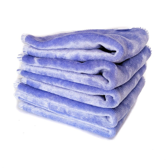 Pile of purple velour cloth wipes.